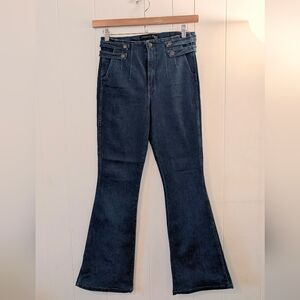 Veronica Beard blue flare jeans with a flattering high-rise silhouette.